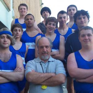 As Coach Peters in Boomer, surrounded by his track team.