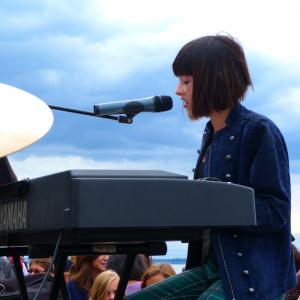 Performing an original song at an outdoor concert