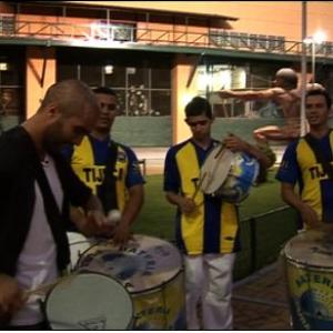 Reporter Tayfun King Playing the Samba Drums Rio de Janeiro Brazil BBC World News television travel show Fast Track