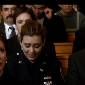 Still of Melia Morgan as policewoman #1 in Rudy: The Rudy Guillani Story
