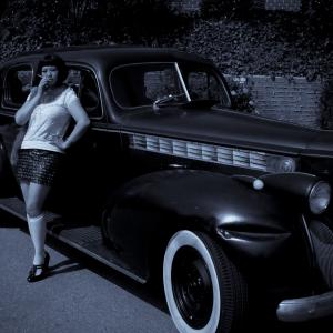 Grace Yang with her collectible car 1940 Super 8 Packard