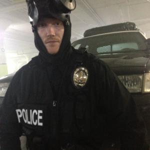 Ryan Burke playing a SWAT officer in Redcape 2013