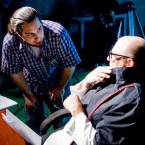On set of Sensory Perception. Alessandro Signore directing Corbin Bernsen in futuristic classroom scene.