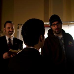 Director Clark Birchmeier working with actors Mark Benjamin and Ray Silveyra in-between takes.