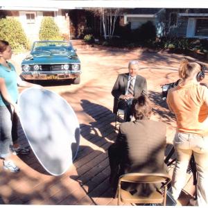 C. Van Tune (back to camera)interviewing Mannix star Mike Connors for Drive TV episode. Car in b.g. is the 1968 Dodge Dart that Connors drove in the Mannix series.