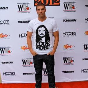 Orange County Fashion Showcase 2012 Red carpet Wearing M The movement Tee and Shoes www.mthemovement.com