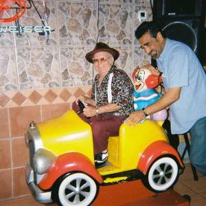Wally Gonzalez in car and Eleazar Garcia Jr. pushing during a break -just clowning around. Wally & Eleazar are featured in films 