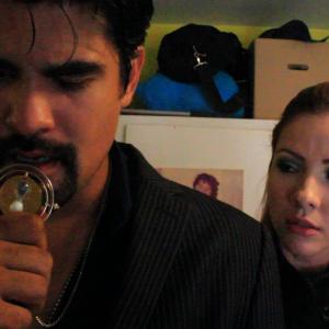 David Cid Robert debates in his mind if he should give his wifes necklace to Delora played by Lisa May in the up coming film Warning currently in production and being directed by Rigoberto Ordaz