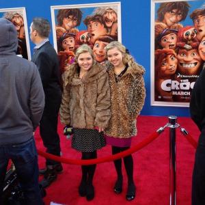 Cailin Loesch left and twin sister Hannah Loesch at the NYC premiere of The Croods
