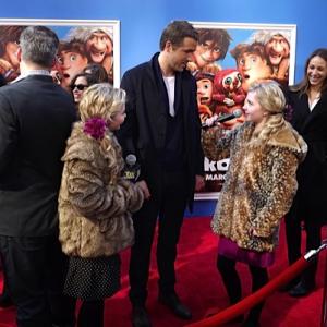 Cailin Loesch right and twin sister Hannah Loesch interviewing Ryan Reynolds at the NYC film premiere of The Croods
