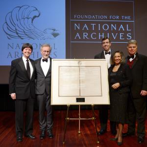 Foundation for the National Archives Board Vice President and Gala Chair Ken Burns filmmaker and honoree Steven Spielberg Executive Director of the Foundation for the National Archives Patrick Madden Foundation for the National Archives Chair and President ALelia Bundles and Archivist of the United States The Honorable David S Ferriero pose onstage with two facsimile versions of the 13th Amendment at the Foundation for the National Archives 2013 Records of Achievement award ceremony and gala in honor of Steven Spielberg on November 19 2013 in Washington DC