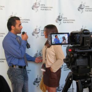 At the ARPA International Film Festival WriterDirectorProducer and star of the new explosive movie I Am Neda Nicole Kian Sadighi being interviewed on the Red Carpet