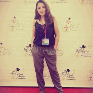 Awardwinning Writer Director And Actor Nicole Kian Sadighi on the red carpet at the Lady Filmmakers Film Festival where I Am Neda was the official selection and winner of the Jury Award