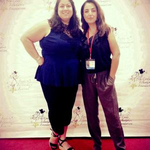 Awardwinning Writer Director And Actor Nicole Kian Sadighi with Patricia DiSalvo Viayra on the red carpet at the Lady Filmmakers Film Festival where I Am Neda was the official selection and winner of the Jury Award