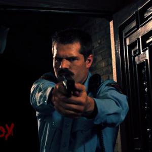 Pierre Kennel as Officer Andy Pohlman in Sick Boy
