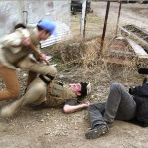 Director producer writer and sometimes cinematographer William Norton shoots a fight sequence between Matthew Gilliam and Andrew Montanez on the set of his political thriller False Colors