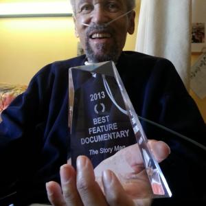 leslie  the story man holding the award for best feature documentary
