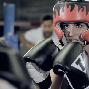 Athena (Jenna Kenall) in a sparring match.