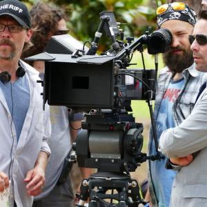 Director Miles Doleac left sets up a shot with Camera Operator Derek Fisher center and James Callis right