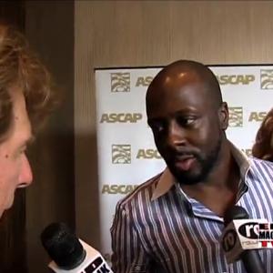Rapper singer record producer and politician Wyclef Jean and Pete Allman