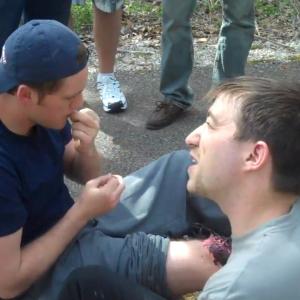 Applying a gun shot wound to Actor Tommy Martin on location for New World OrdeRx 2013