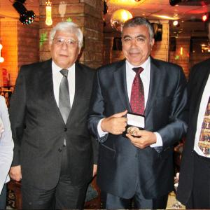 May 2014 - Egypt - Gov Tarek Mahdi Alexandria holding the Disney Partnership Medallion