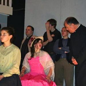 Actress Mary Rose Maher on stage with fellow actors in McGivney The Musical
