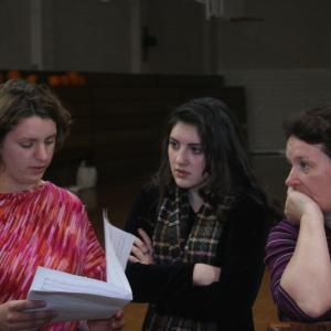 Mary Rose Maher with actresses Karina Bihar, Susanna Bihar and Carrie Kot going over the sheet music for the musical McGivney!