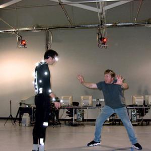 Scott Duthie discusses virtual camera angles and movement as he prepares a motion capture performer for the scene.