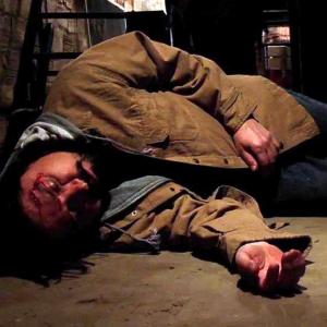 Man laying unconscious after Jimmy hit him in the head in The Basement