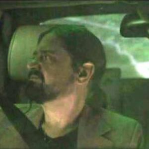 Jed worried while driving in the car in Six Planets of the Song
