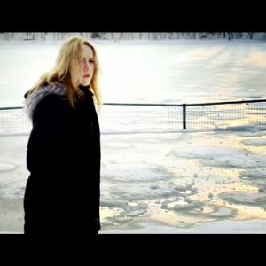 Still of Laura Burnett in music video