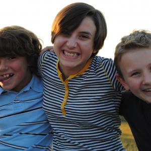 Young Rob (Lucas Pigeon), Young Ellen (Hannah Gaskins) and Young Phil (Caulder Council) on the set of 