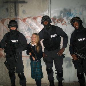 Samantha Page on set with swat team.