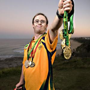 Ty Belnap with some of his medals, won swimming for Australia. Ty stars in Just Like U.