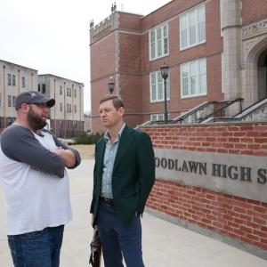 Andrew Erwin on the set of Woodlawn with actor Nic Bishop.