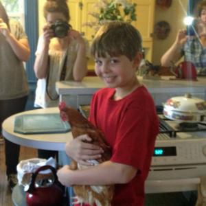 Alexander and his friend the chicken behind the scenes filming Happy Acres