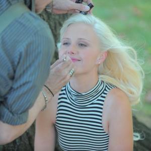 Dawn Sobolewski getting makeup applied during a photoshoot