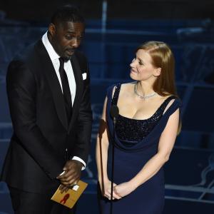 Idris Elba and Jessica Chastain at event of The Oscars 2015