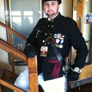 Valiant as a SeaAirship Steampunk Captain for the Steampunk Symposium 2015 on board the Queen Mary ship in Long Beach CA January 2015 All medals and uniform are completely fictional and for Steampunk cosplay only