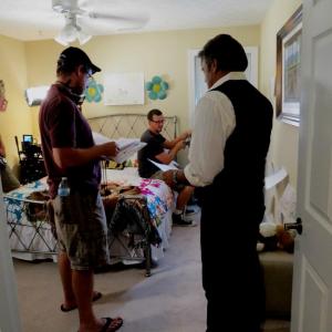 Director Justin Rossbacher (left) reviews script with Erik Estrada (right) on the set of Finding Faith.