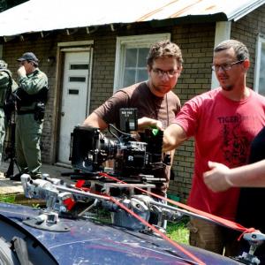 Reviewing playback on West Virginia State Police carmounted camera with DP Marc Hutchins and editor Won Novalis on the set of Finding Faith