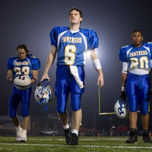 Taylor Kitsch Gaius Charles and Scott Porter in Friday Night Lights 2006