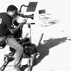 Director/Camera Operator Dee Asaah captures a shot on the set of the action thriller Blood Sun Town.
