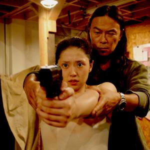 Still of Kairi Narita and Asami in Gun Woman 2014