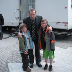 Tony Terraciano with his brother Andrew and Donnie Wahlberg on the set of Blue Bloods.