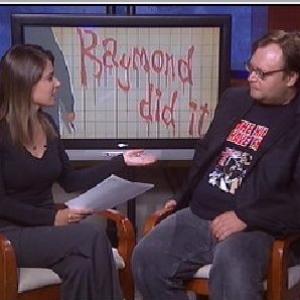 Travis appearing on Rockford News to promote Raymond Did It