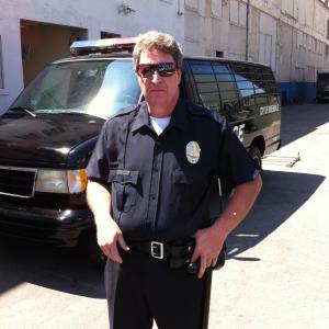 Paul Rose, Jr., as Officer Scott Joseph, on the set of Damn Foreigners.