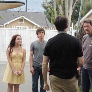 Owl City Gold Music Video  Director Paul A Rose Jr consulting with DP Garrett OBrien on the next shot while Sophie Gattie  Charlie Smith look on