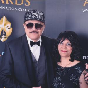 Celebrity music artistfilm producer Byron Byrd and his wife Pam are invited guests at the 2015 Screen Nation Awards in London